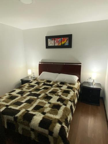 Posteľ alebo postele v izbe v ubytovaní Apartaestudio Chiquiencanto