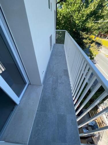 a stairway leading up to a white building at Villa Primule Cattolica in Cattolica