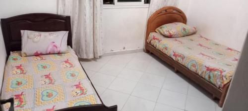 Postel nebo postele na pokoji v ubytování Appartement pour location journalière sur Tanger