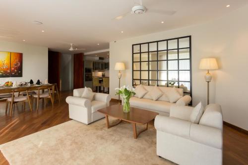 a living room with a couch and a table at Serene Villa 38 in Kandy