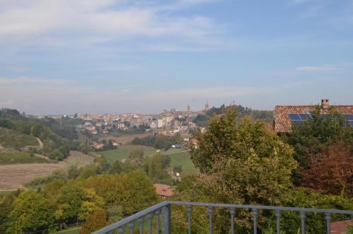 a view of a city from the balcony of a house at Villa Patrizia in Moncalvo