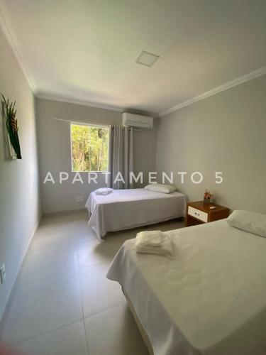 Postel nebo postele na pokoji v ubytování Apart Hotel Angra dos Reis II