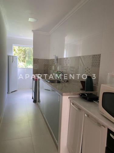 Kuchyň nebo kuchyňský kout v ubytování Apart Hotel Angra dos Reis II