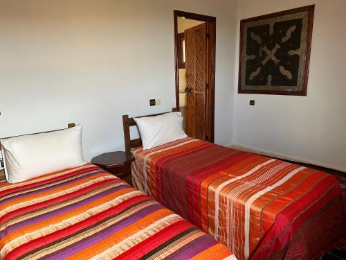 מיטה או מיטות בחדר ב-Ourika lodge the healing place