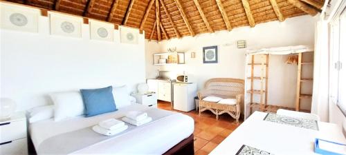 a bedroom with two beds in a room at Mandala Bungalows - Adults Only in Los Caños de Meca