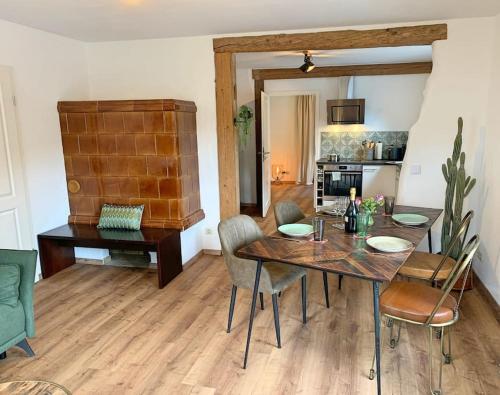 a dining room with a table and chairs at Ferienwohnung am Bodensee in Singen