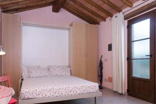 Katil atau katil-katil dalam bilik di Monolocale per due Agriturismo le Pinete