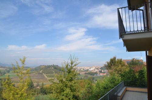 a balcony of a house with a view of a city at Villa Patrizia in Moncalvo