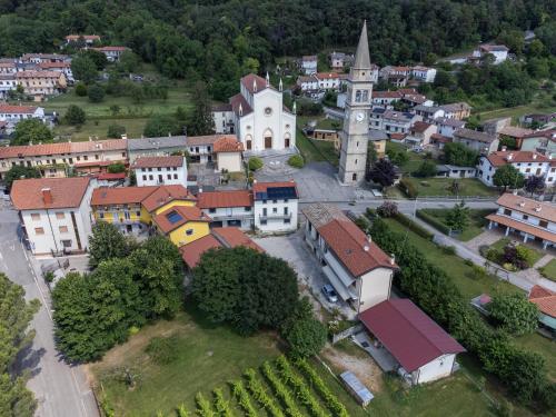 an aerial view of a small town with a church at Vigna degli Angeli in Ragogna