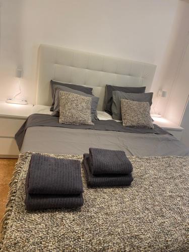 a bedroom with a bed with two pillows on it at Studio La Carihuela in Torremolinos