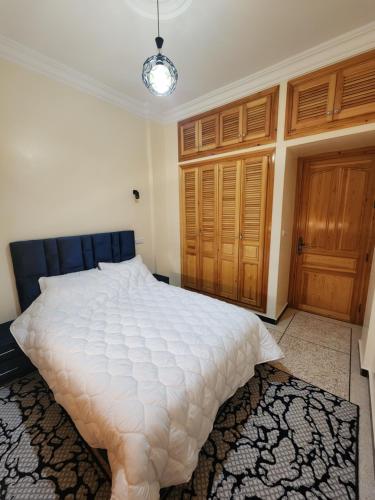 En eller flere senger på et rom på Residence Almaraghi
