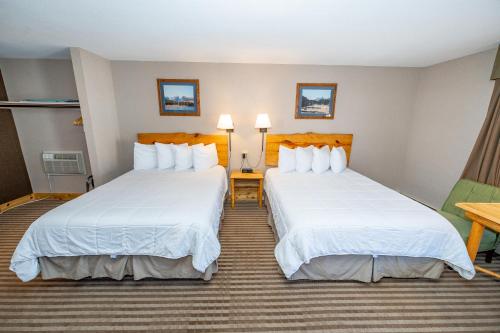 Ένα ή περισσότερα κρεβάτια σε δωμάτιο στο Hotel Estes