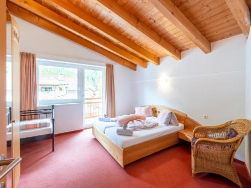 a bedroom with a bed and a window at Haus Anna in Längenfeld