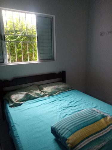 Postel nebo postele na pokoji v ubytování Edicula perto do Aquário