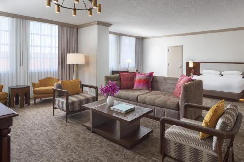 a living room with a couch and a bed at Hyatt Regency Coral Gables in Miami in Miami