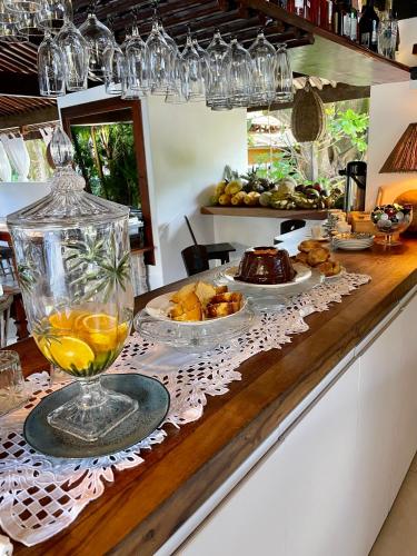 a buffet with food and drinks on a counter at Pousada Tartaruga Boutique Hotel in Pipa