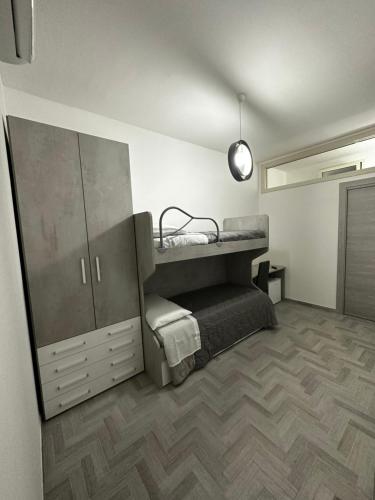 מיטה או מיטות בחדר ב-Alloggio Pulcinella 2 Affittacamere