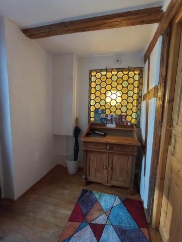 a bathroom with a stained glass window in a room at La Cigogne dorée Gite de charme 4 étoiles in Schiltigheim