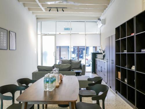 a living room with a table and chairs at Aayu Chulia - Chulia St, George Town in George Town
