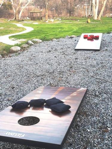 a display with three red ties on top of a table at Oasis Riverfront House -10 min to Sequoia in Three Rivers