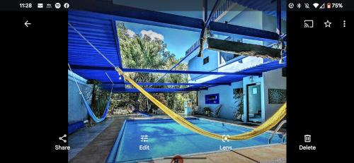 een foto van een zwembad met schommel bij The Blue Eco Lodge in Valladolid