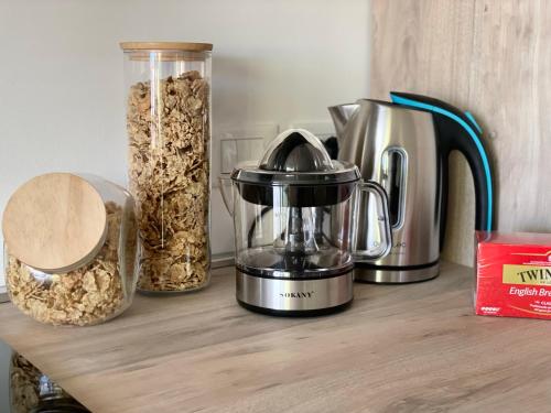 a counter with a blender and some oats on it at Maison de Cheeramie - Tourist Apartments Tra Mare e Etna in Mascali
