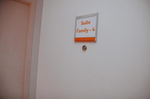 a sign on a door that reads wife family at Rede Andrade Lapa in Rio de Janeiro