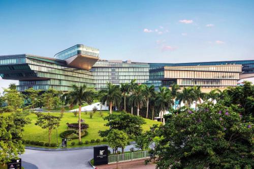 an office building with a park in front of it at JW Marriott Hotel Hanoi in Hanoi