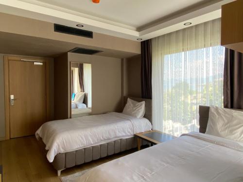 Katil atau katil-katil dalam bilik di Şehrar Suite Hotel