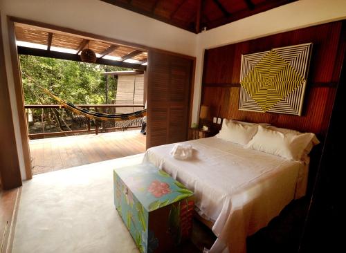 Postel nebo postele na pokoji v ubytování Boa Village- Bungalow Amarelo- Praia de Algodões- Península de Maraú, BA