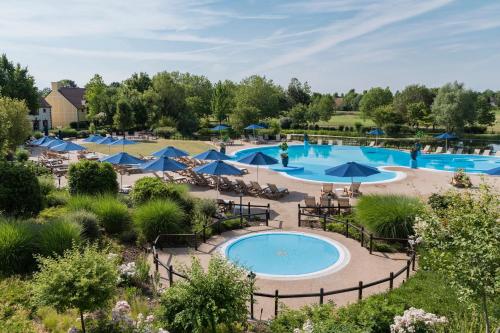 an aerial view of a pool at a resort at Marriott's Village d'Ile-de-France in Bailly-Romainvilliers