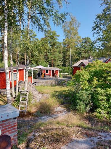 a view of a campground with a house and trees at Ljungdahl in Korppoo