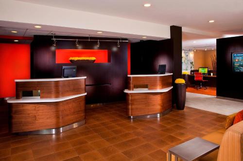 a lobby of a hotel with a reception desk at Courtyard Melbourne West in Melbourne