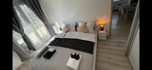 a bedroom with a large bed with pillows at N.Cristian Apartment in Budapest