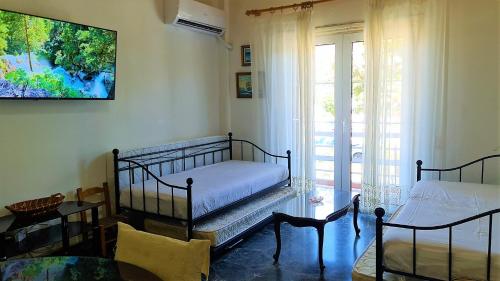 Ένα ή περισσότερα κρεβάτια σε δωμάτιο στο Eva Seaside 1st Floor