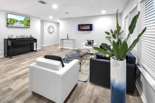 a living room with white furniture and a piano at Luxury @ SixFlags and LaCantera Hot Tub+Grill in San Antonio