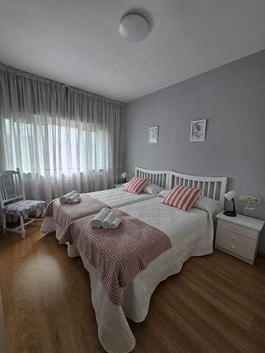 Postel nebo postele na pokoji v ubytování MEDA Padrón