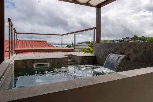 a plunge pool on the roof of a house at La Suite Villa in Les Trois-Îlets