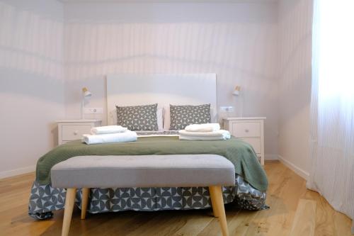 Postel nebo postele na pokoji v ubytování Adarve, con parking y vistas a la muralla