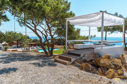 a house with a view of the ocean at Kallithea Residence in Koskinou