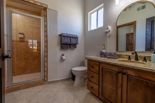 a bathroom with a shower and a toilet and a sink at Sandy Beach Costa Diamante E15 House Game Room Dog Friendly in Puerto Peñasco