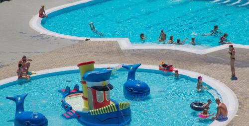 a group of people in a swimming pool at Cyprotel Faliraki in Faliraki