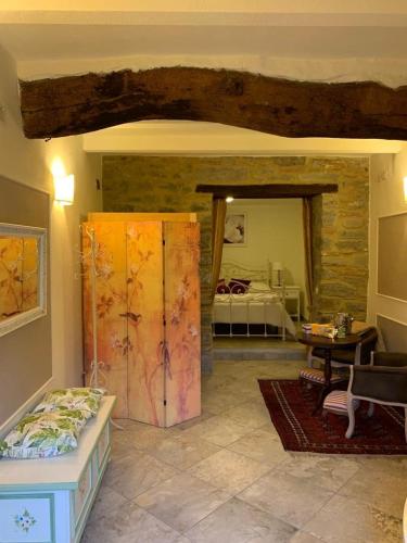 a room with a bed and a room with a bedroom at Il Vicolino in Cortona