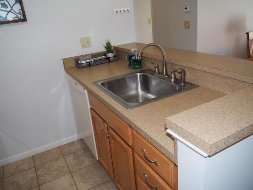 a kitchen with a sink and a counter top at The Grand Getaway - Gorgeous And Great Location! in Traverse City