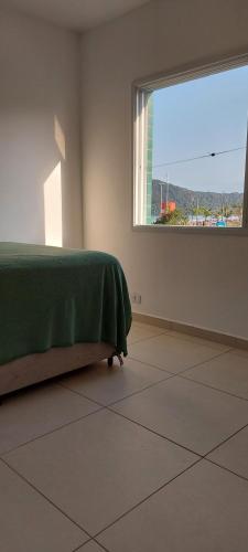 Postel nebo postele na pokoji v ubytování Apartamento pé na areia no centro de Bertioga