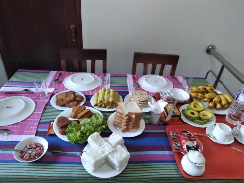 a table with plates of food on top of it at SILVER RAIL in Galle