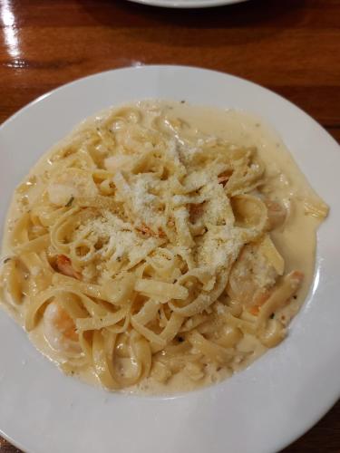 a plate of pasta on a white plate at Royal Hotel Guyra in Guyra
