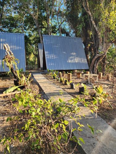 a house with solar panels on the roof at D'flora Bungalow & Glamping in Noca