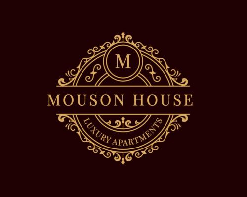 a luxury logo for a mansion house with a crown at Mouson House Luxury Apartments in Kavala