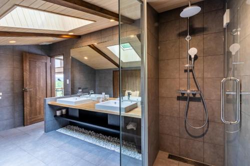 a bathroom with two sinks and a shower at SANGA HOUSE in Kutchan